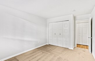 bedroom with closet and carpeted floor