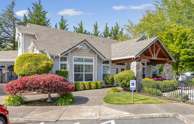 A leasing office with parking in front of it at Abbey Rowe Apartments in Olympia, WA