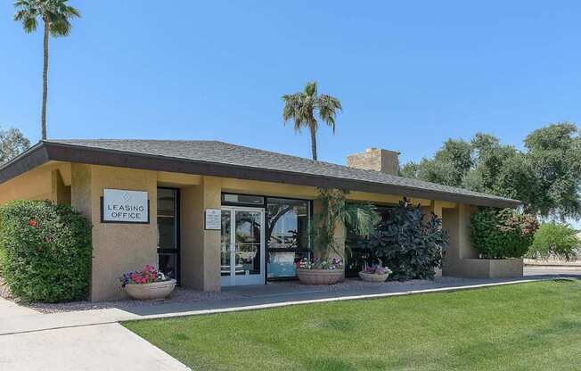 A building with a leasing office sign on it.