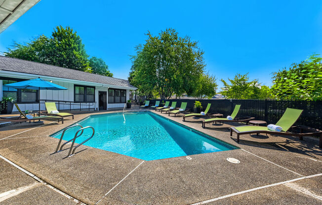 Apartments for Rent in Lake Oswego OR - Westlake Meadows - Sparkling Pool Surrounded by Lounge Seating