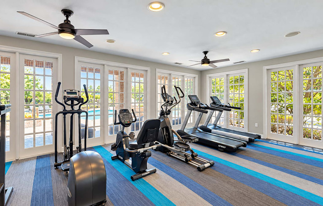 Fitness center with treadmills, ellipticals, and a recumbent exercise bike at Elevation 3505 in Atlanta, GA.
