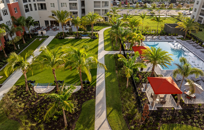 Experience luxury living with stunning gardens and a refreshing pool.