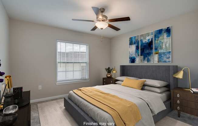 a bedroom with a bed and a ceiling fan