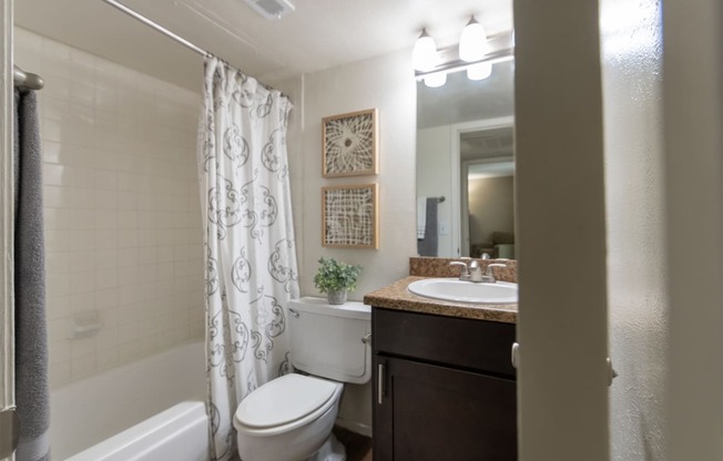 This is a photo of the bathroom of the 590 square foot 1 bedroom, 1 bath model apartment at The Biltmore Apartments located int he Vickery Meadow neighborhood of Dallas, TX.