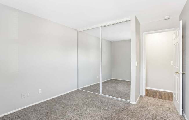 A room with white walls and a carpeted floor.