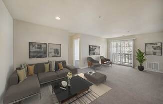 Living with couch and table at The Apartments at Owings Run, Owings Mills, Maryland