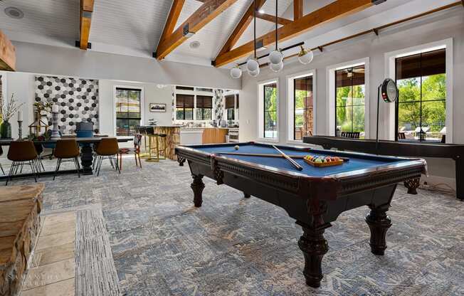 Riverstone - Newly Renovated Clubhouse with Large windows, Billiards Table, Sitting Area, and Demonstration Kitchen