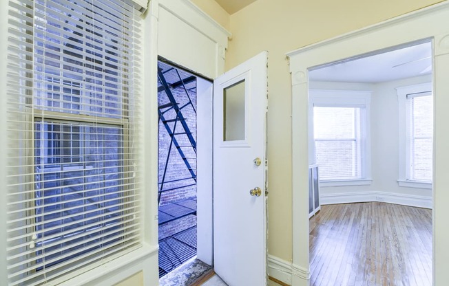 hallway with view of living area and balcony at dupont apartments in washington dc