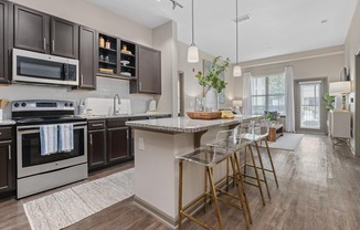Open Living Room and Kitchen at RiverHouse Apartments in Little Rock, AR
