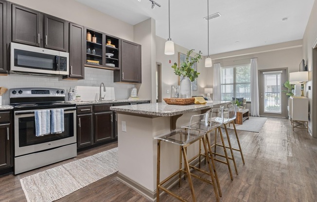 Open Living Room and Kitchen at RiverHouse Apartments in Little Rock, AR