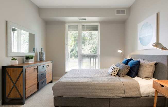 Master Bedroom With Balcony at The McMillan Apartments in Shoreview, MN 55126