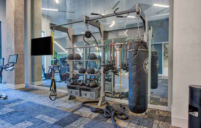 a boxing bag and other equipment in the fitness center