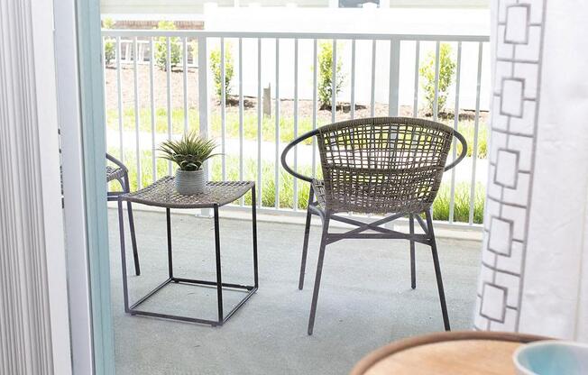 a patio with a chair and a table  at Sapphire at Centerpointe, Virginia