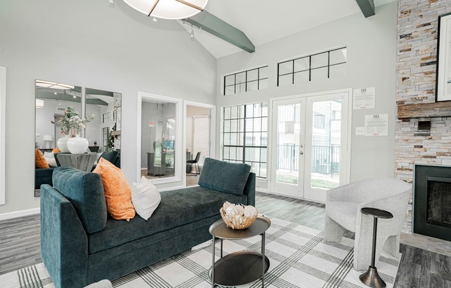 an open living room with a couch and a fireplace