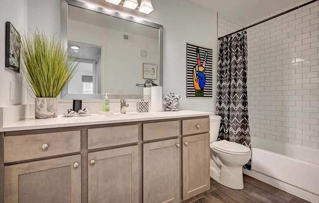 A bathroom with a white toilet and a white sink.