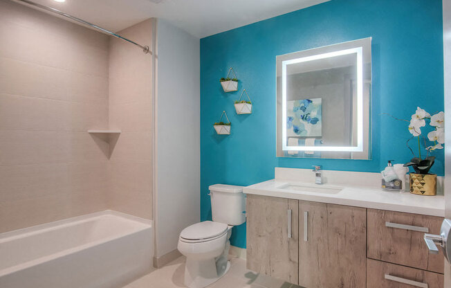 Lower Bathroom With Tub And Sink Vanity At The Mansfield At Miracle Mile In California, 90036