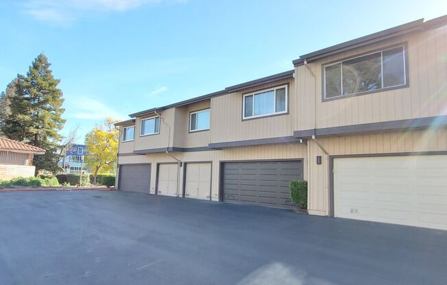 Upstairs Condo with 2 Car Garage, Fresh Paint, Wood Floors, Large Patio, Pool!