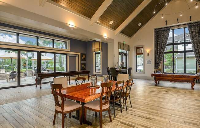 a large gathering room with a pool table and ping pong table  at Cabana Club - Galleria Club, Jacksonville, FL