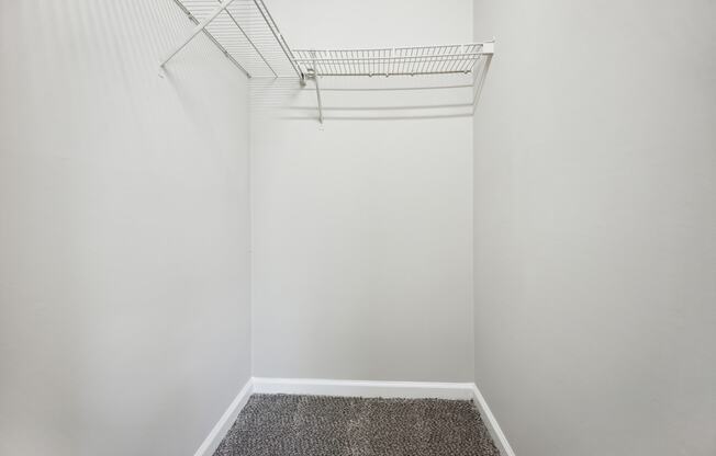 a walk in closet in a 555 waverly unit