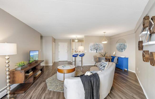 a living room with a couch at Troy Place Apartments - Troy, MI, Troy, 48084