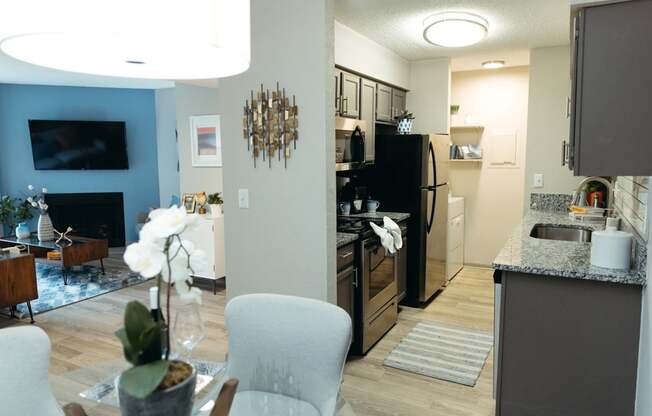 a view of the kitchen and living room from the dining room