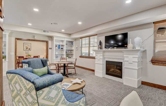 a living room with a fireplace and a tv