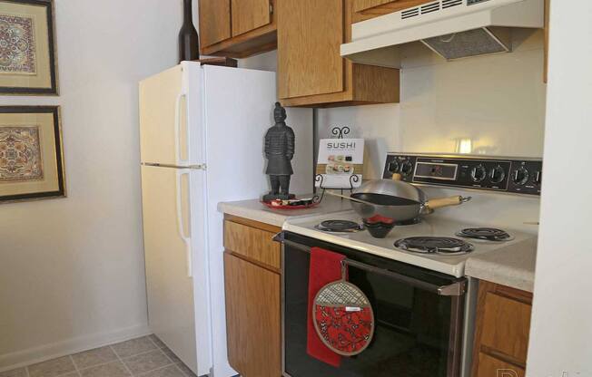 a kitchen with a stove and a refrigerator