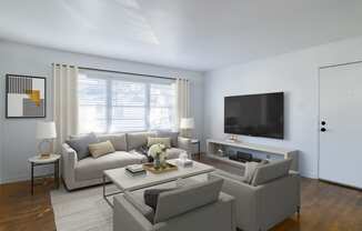 a living room with a couch and a coffee table at Ann Street Lofts, Mobile, 36604