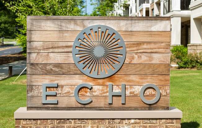 Lush landscaping surrounds you as you drive into Echo at North Pointe Center Apartment Homes, Alpharetta, GA 30009