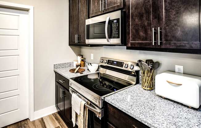 Kitchen with stainless steel appliances at Sterling Prairie Trail North in Ankeny, IA