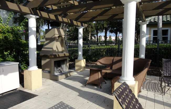 Outdoor sitting area with fireplace Allegro Palm Riverview Florida
