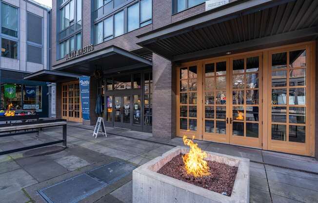 a fire pit in front of a building