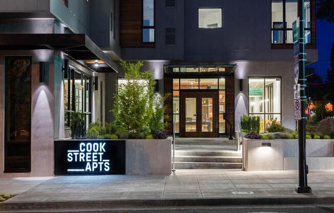 Front entrance at night at Cook Street Apartments, Portland