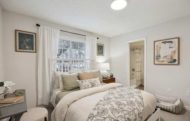 a bedroom with a large bed and a window at St. Andrews Reserve, North Carolina, 28412