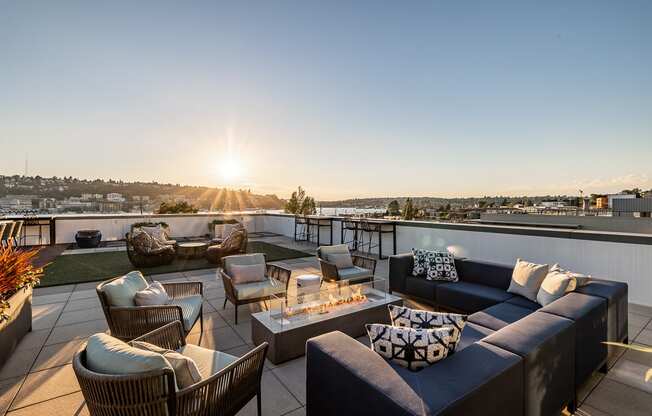 Equinox Rooftop Terrence seating area with firepit at Equinox Apartments, Seattle, WA, 98102