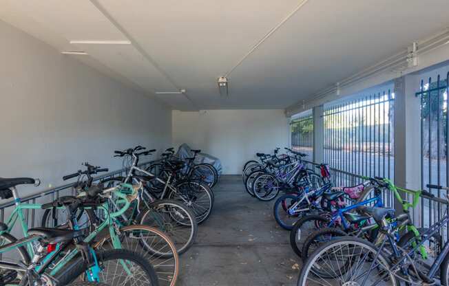 a large group of bikes parked in a room