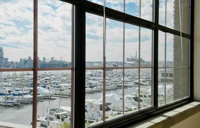 a window view of a marina filled with boats at Tindeco Wharf, Baltimore, MD 21224