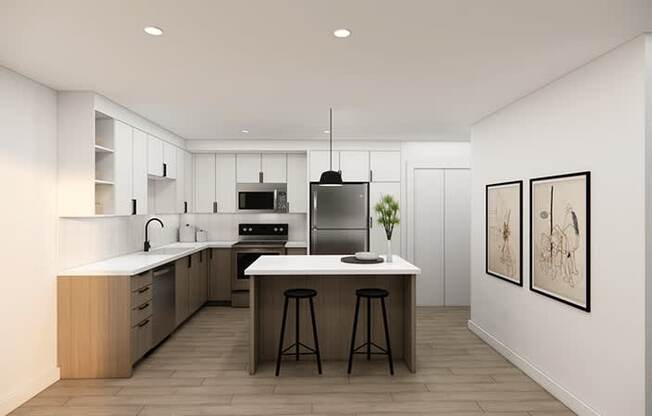 A modern kitchen with a center island and bar stools.