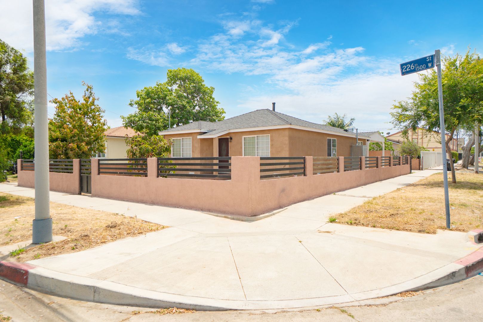 RECENTLY REMODELED, BRIGHT & AIRY 3BR2BA HOUSE ON SPACIOUS CORNER LOT W/ LARGE WRAP AROUND YARD & PATIO AREAS, GATED DRIVEWAY W/  LARGE COVERED CARPORT CLOSE TO SCHOOLS, PARKS, SHOPPING & EASY FREEWAY ACCESS!