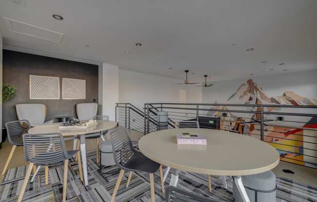 clubhouse loft area with tables and chairs and a staircase