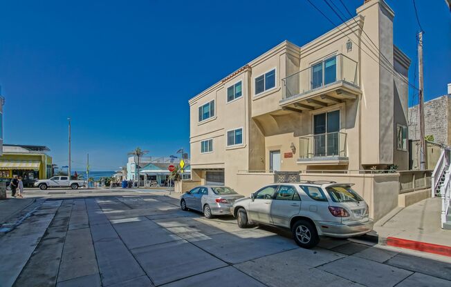 RECENTLY REMODELED, LUXURIOUS & BRIGHT, TRI-LEVEL, 4BR/3.5BA HOME W/ AMAZING PANORAMIC OCEAN VIEW IN HEART OF NORTH MB STEPS TO BEACH, SHOPS & RESTAURANTS -