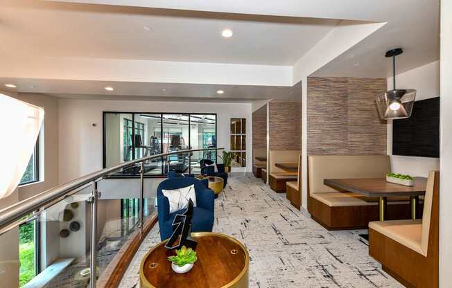 A modern living room with a wooden coffee table and a patterned carpet.