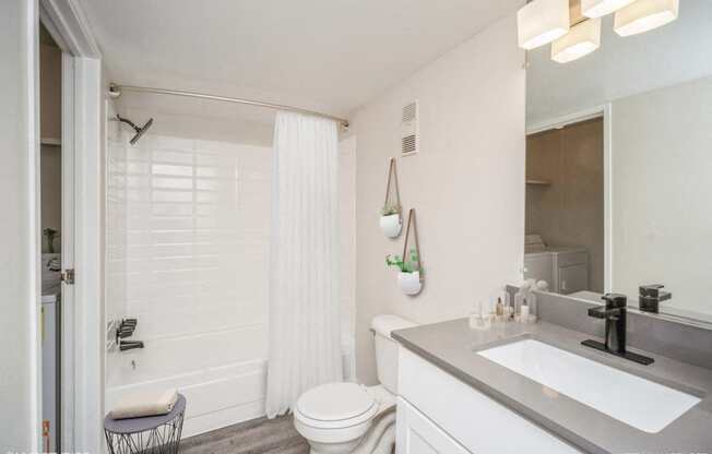 Bathroom with a sink and a toilet  at Avery Park in Englewood, CO