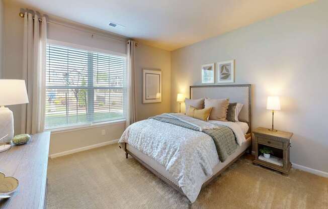 a large bedroom with a ceiling fan and window