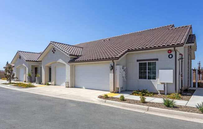 a home with a gray exterior and a white garage door