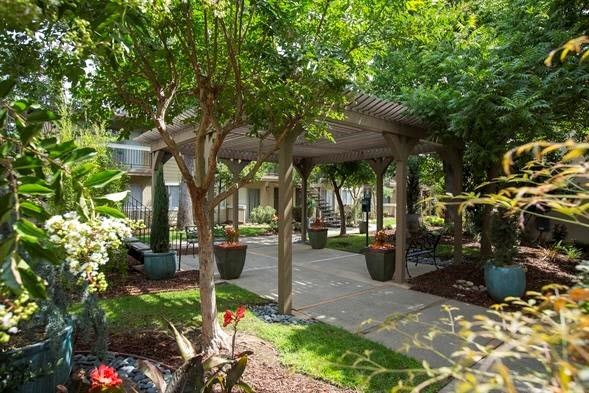 Beautifully landscaped grounds with community seating areas.
