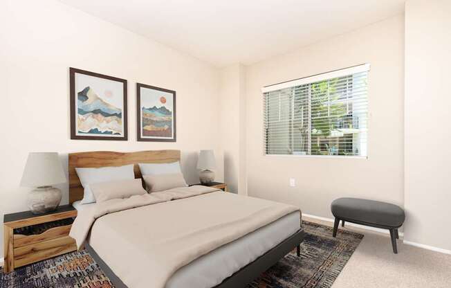 A bedroom with a large bed, a bench, and two pictures on the wall.
