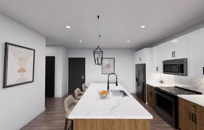 A modern kitchen with a marble island and pendant lighting at Refinery at Pointe17 Apartments, Phoenix
