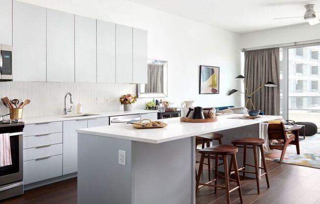 Light-filled apartments with custom cabinetry, stainless steel appliances and islands with bar seating