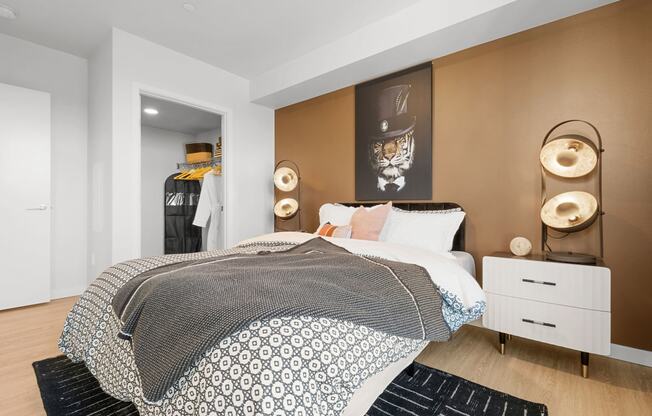 a bedroom with a bed and a dresser in front of it at Ion Town Center, Washington, 98133